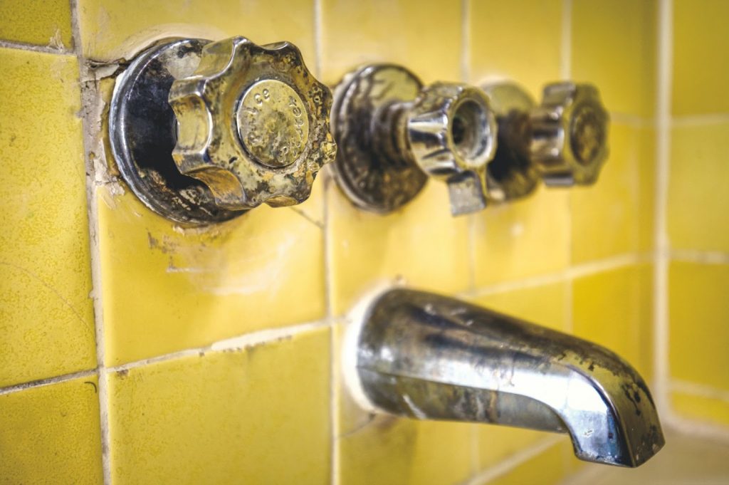 How to regrout tile without removing old grout